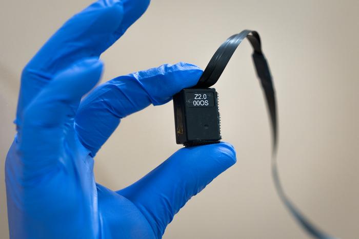 Image: A researcher holds an Optically Pumped Magnetometer (Photo courtesy of Qualcomm Institute/UC San Diego)